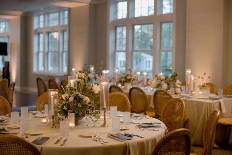 reception dinner table setup for wedding with white flowers